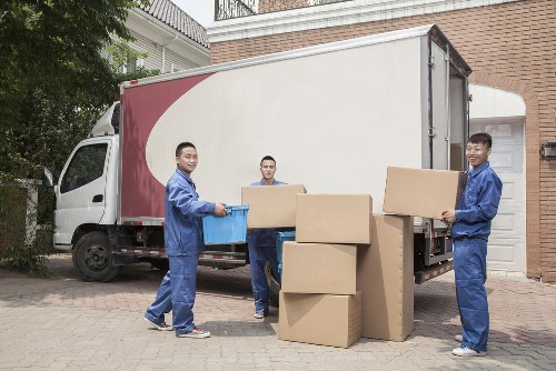 Moving boxes being carried through a flat building in Haringey