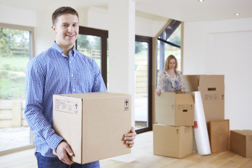 Careful packing and loading of office furniture for a local business move