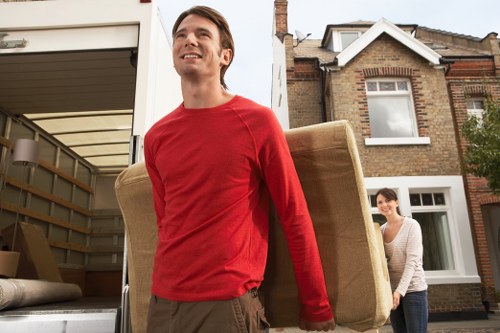 Packed boxes and furniture ready for a local flat removal service