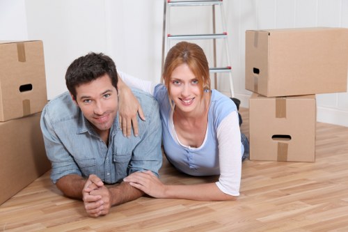 Worker using protective equipment while moving furniture