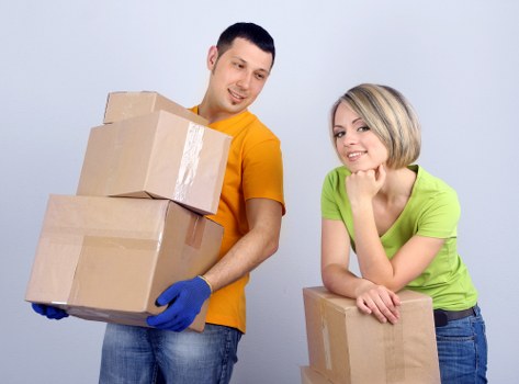 Moving crew loading furniture into a removal van