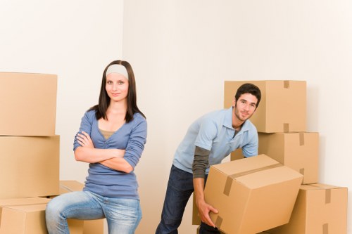 Furniture and boxes being loaded into a van for transport in North London