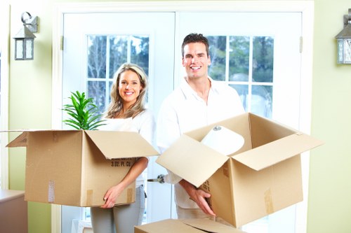Movers handling desks and office furniture during a relocation in Haringey