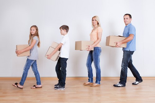 Business relocation planning with labelled boxes and office equipment