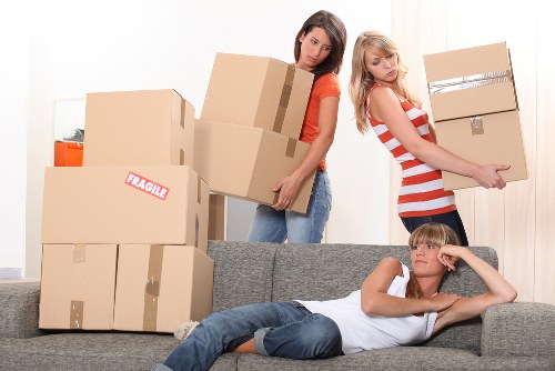 Careful handling of household items during a flat move in Haringey