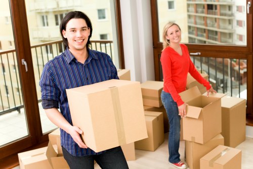 Packed moving boxes and furniture prepared for truck loading