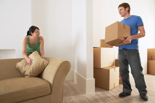 Office furniture being transported during a commercial move in Haringey